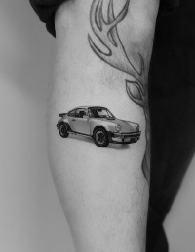 Microrealism tattoo of a car by Paweł Indulski @pawelindulski